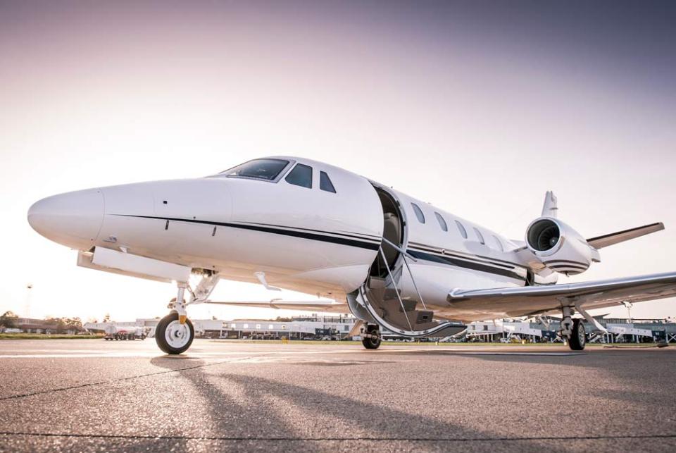 private jet landing on runway