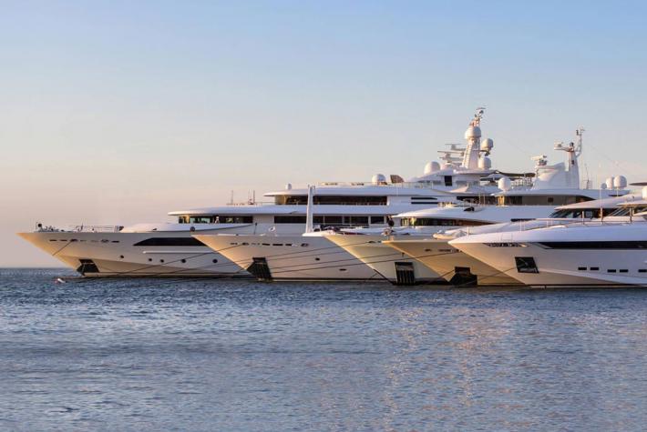 A group of yachts moored by the harbour