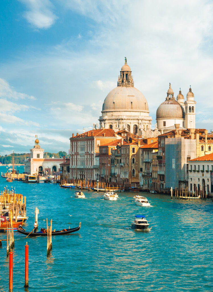 Gorgeous view of the Grand Canal and Basilica Santa Maria della Salute during sunset with interesting clouds, Venice, Italy