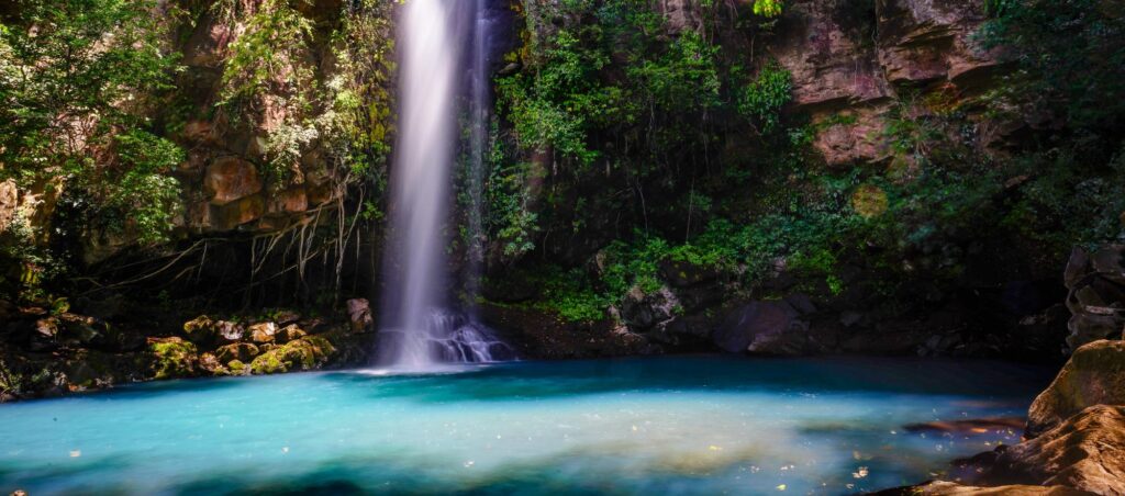 scenic waterfall in the middle of a jungle scene